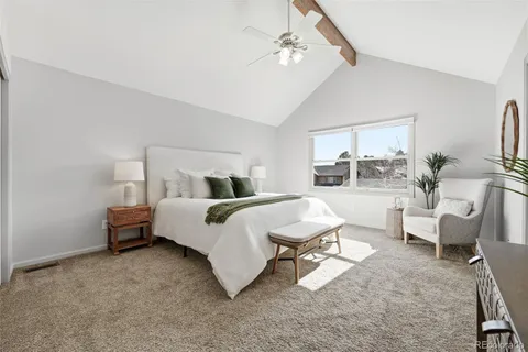 a bedroom with furniture and a chandelier