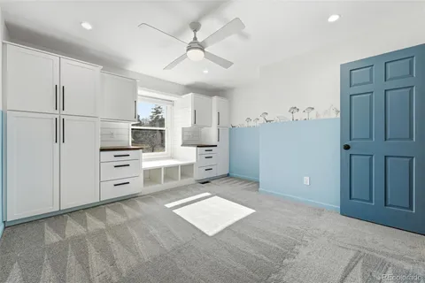 a view of a kitchen with electric appliances