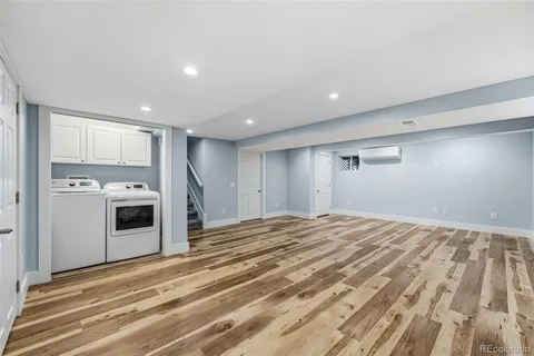 a view of a kitchen with an empty space and a window