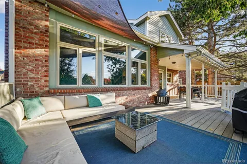 a view of house with couch and chairs