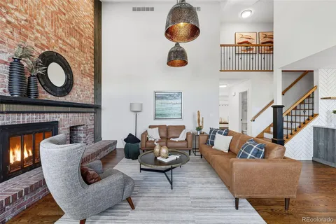 a living room with furniture and a mirror