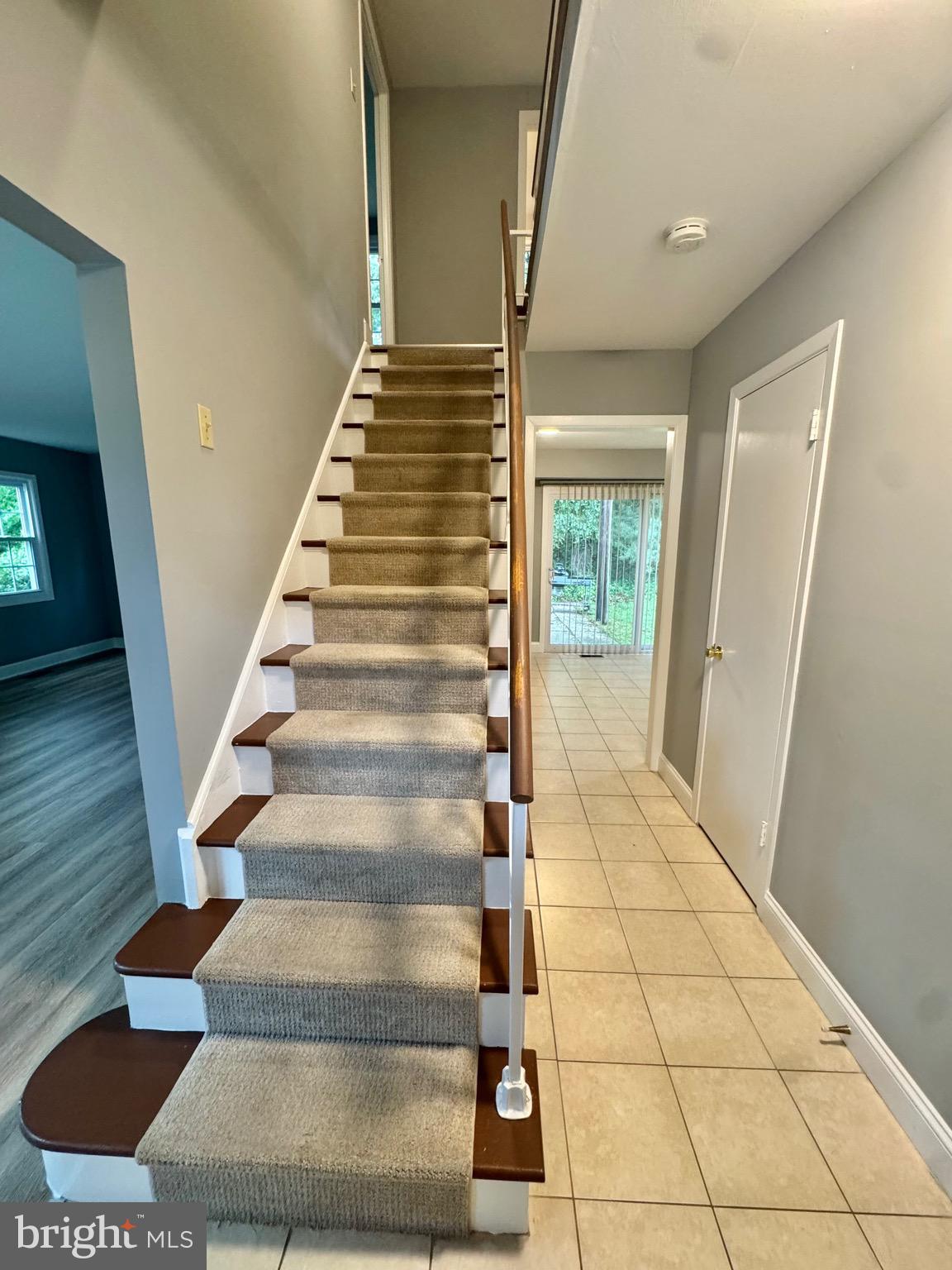 4908 Rocky Spring Lane Bowie, MD 20715 - Photo 2 of 36 a view of staircase with white walls and a rug
