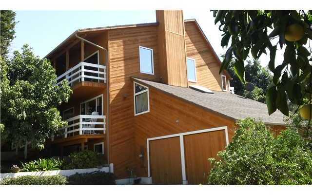 1113 Big Oak Ranch Road Fallbrook, CA 92028 - Photo 15 of 16 Side view of front of home with balconies and 2 car garage.