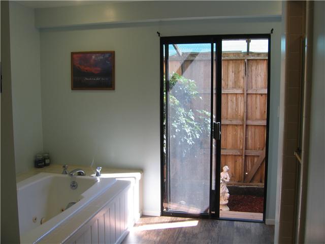 1113 Big Oak Ranch Road Fallbrook, CA 92028 - Photo 5 of 16 Bathroom with sliding door to a quaint atrium.