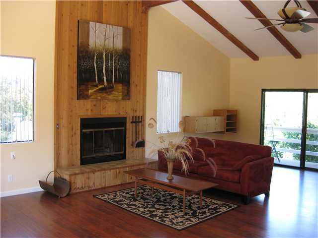 1113 Big Oak Ranch Road Fallbrook, CA 92028 - Photo 7 of 16 High beam ceilings, upgraded laminate flooring and wood burning fireplace.