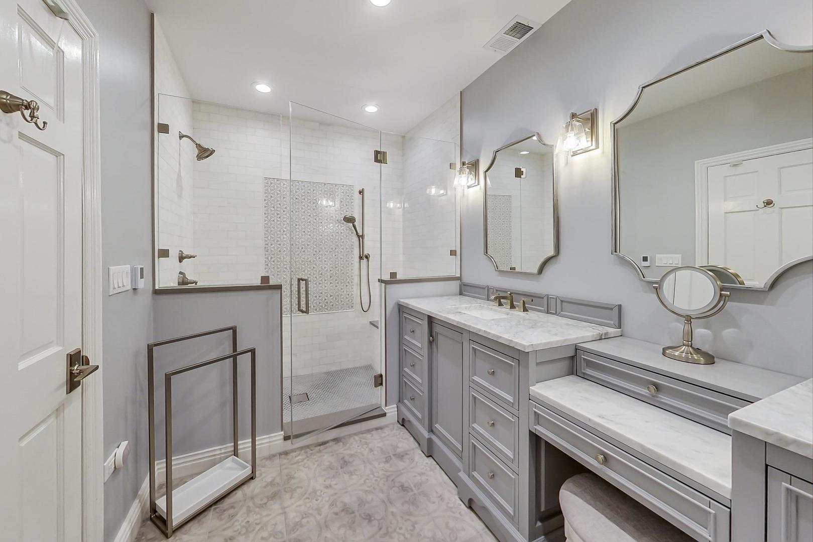 2630 North Racine Avenue Chicago, IL 60614 - Photo 25 of 47 a spacious bathroom with a double vanity sink mirror and toilet
