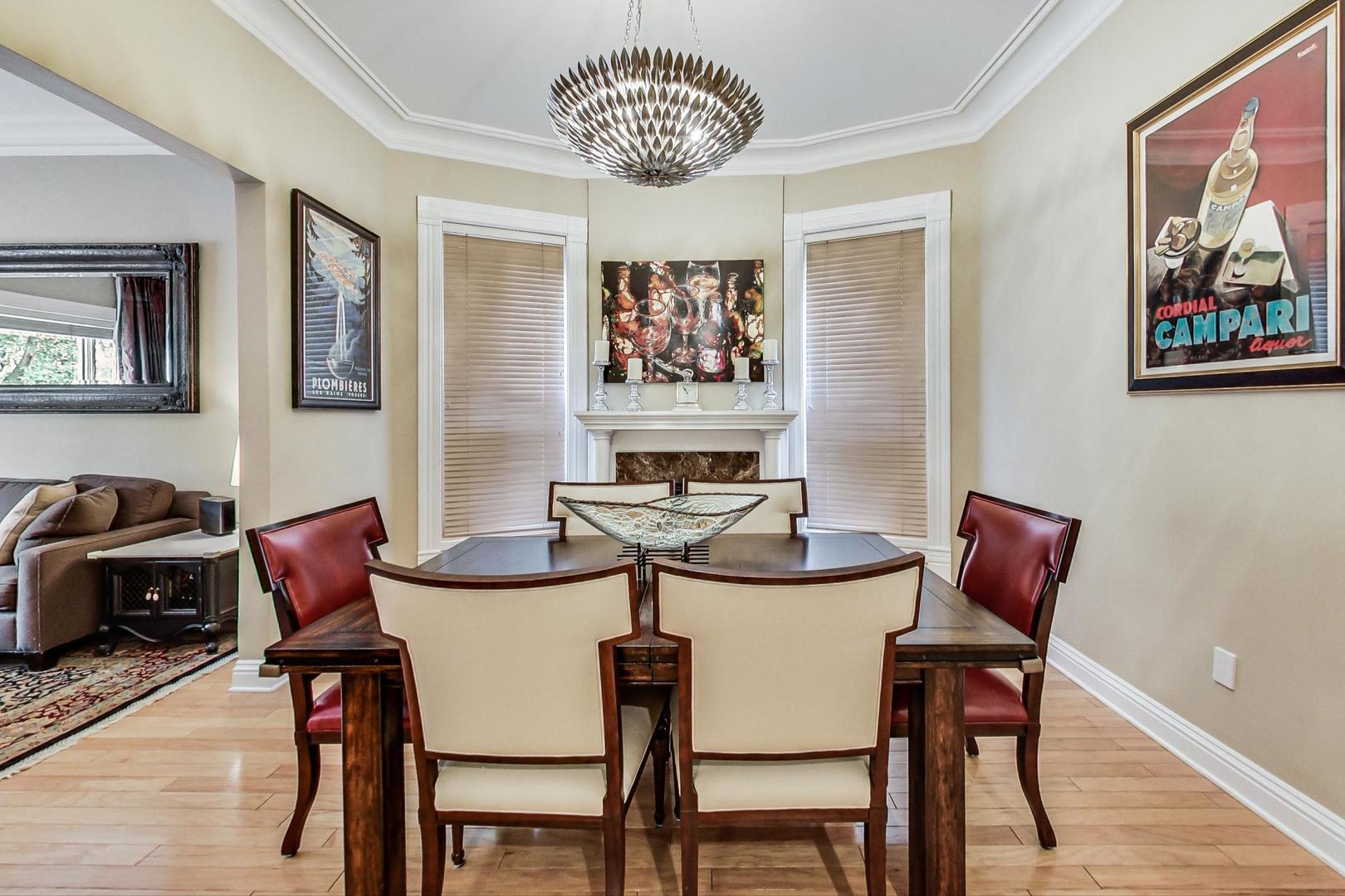 2630 North Racine Avenue Chicago, IL 60614 - Photo 5 of 47 a view of a dining room with furniture and wooden floor