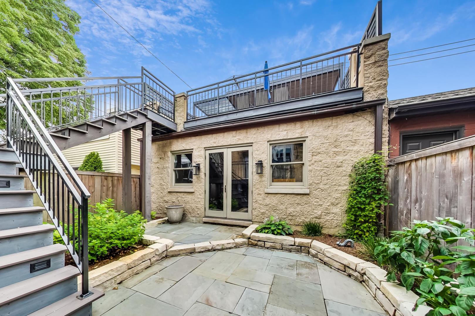 2630 North Racine Avenue Chicago, IL 60614 - Photo 41 of 47 a front view of a house with a garden