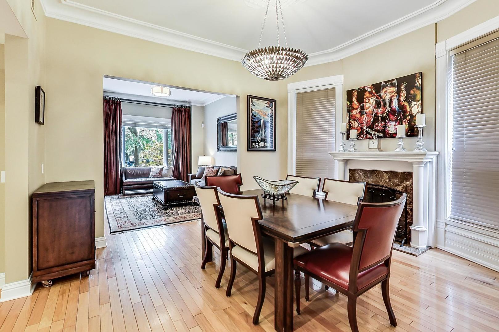 2630 North Racine Avenue Chicago, IL 60614 - Photo 6 of 47 a dining room with furniture a chandelier and wooden floor