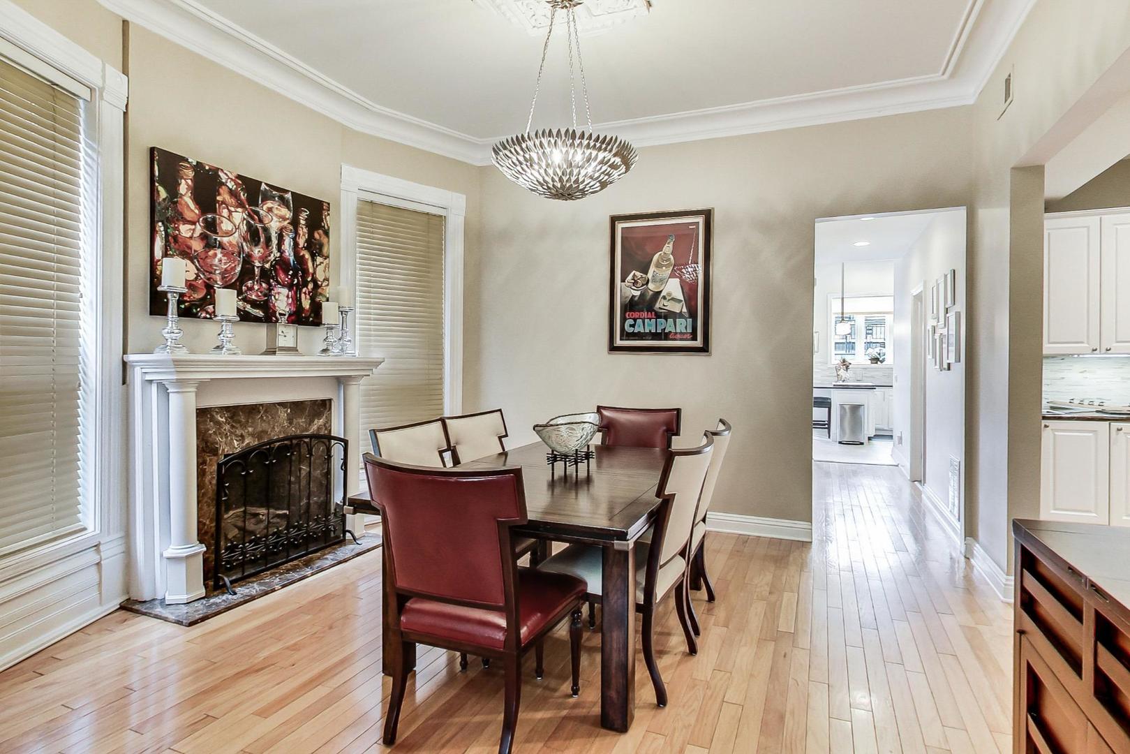 2630 North Racine Avenue Chicago, IL 60614 - Photo 7 of 47 a view of a dining room with furniture wooden floor and a fireplace