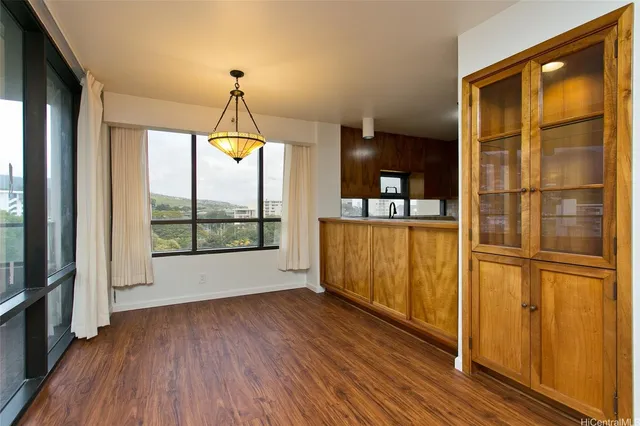 a very nice looking room with wooden floor and a window