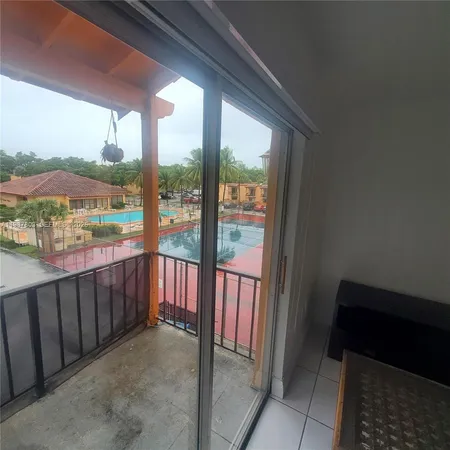 a view of a porch with furniture