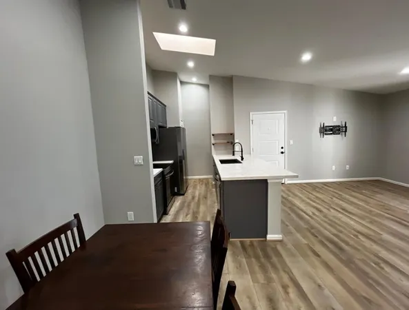 a view of kitchen and wooden floor