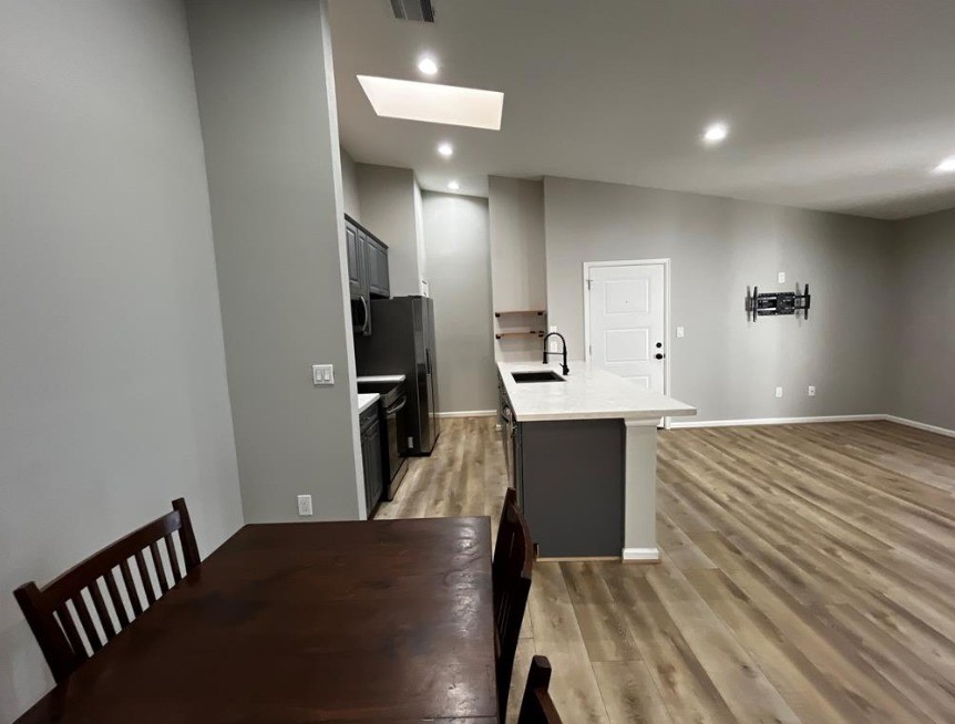 2425 Augusta Drive, Unit 44 Houston, TX 77057 - Photo 14 of 16 a view of kitchen and wooden floor