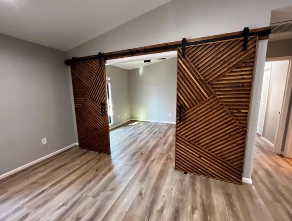 a view of wooden floor and brick wall
