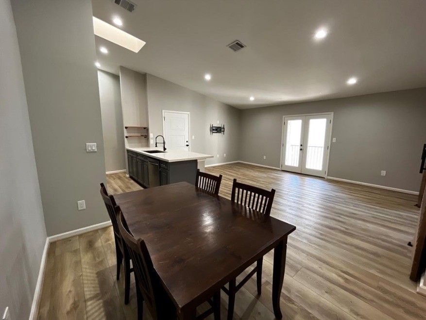 2425 Augusta Drive, Unit 44 Houston, TX 77057 - Photo 7 of 16 a view of a dining room with furniture