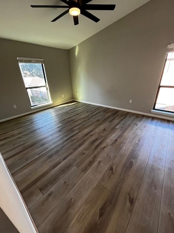 2425 Augusta Drive, Unit 44 Houston, TX 77057 - Photo 10 of 16 an empty room with wooden floor fan and windows