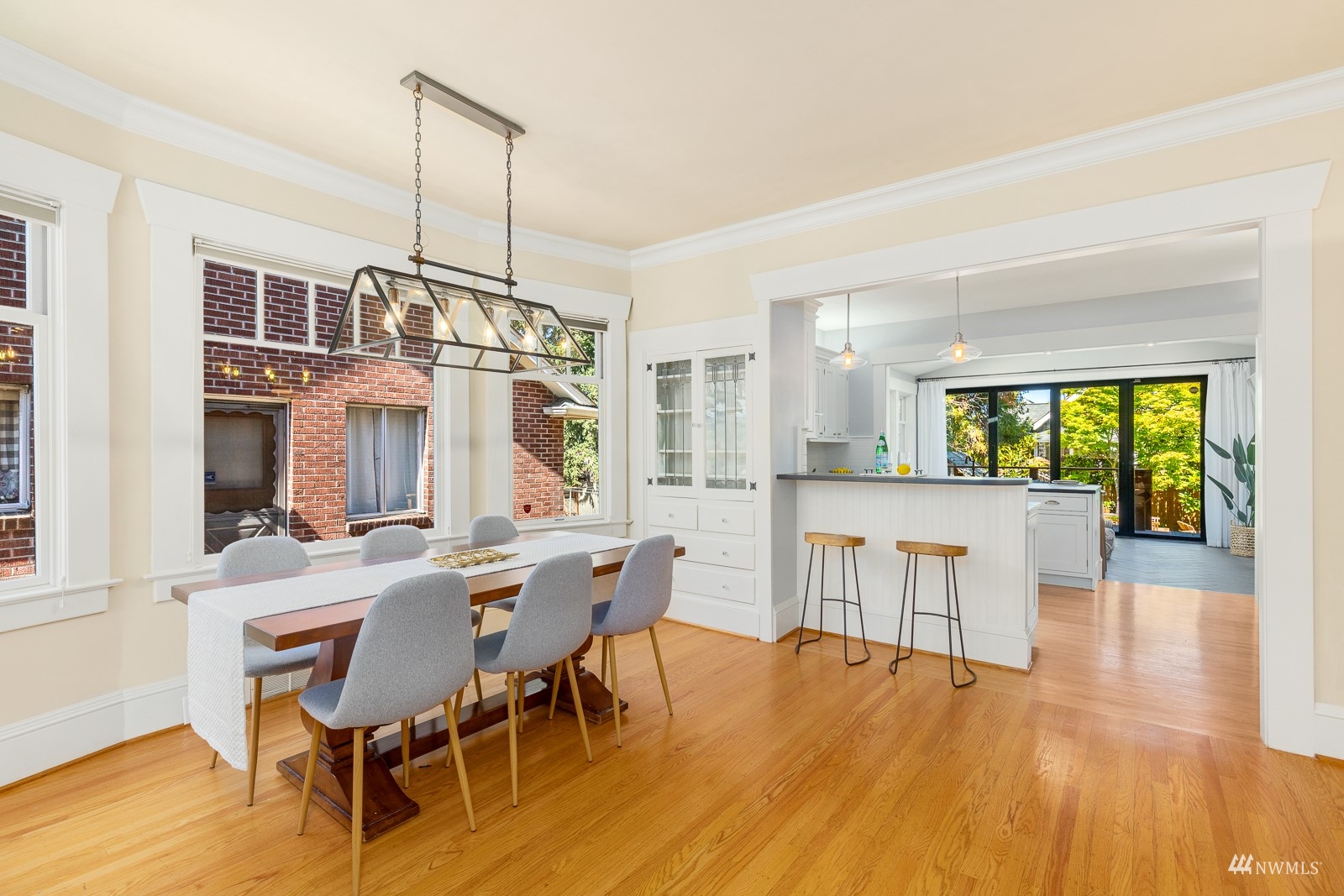 2326 North 59th Street Seattle, WA 98103 - Photo 11 of 38 a view of a dining room with furniture window and wooden floor
