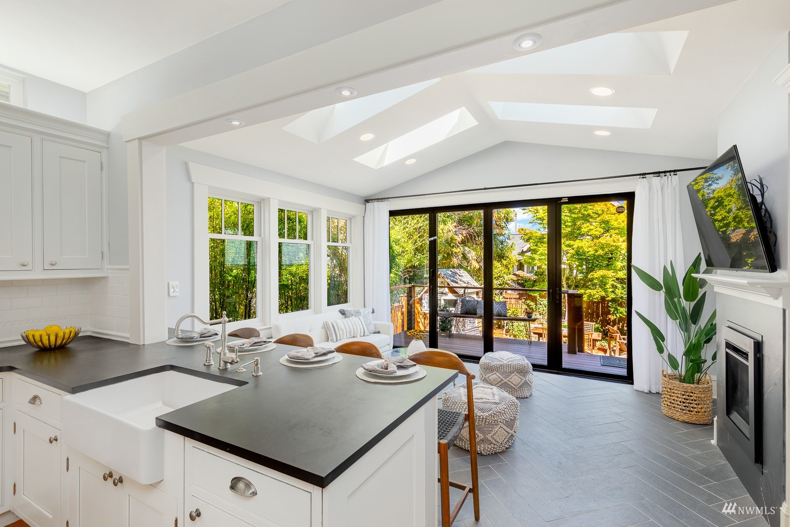 2326 North 59th Street Seattle, WA 98103 - Photo 14 of 38 a very nice looking living room with a large window a couch and a fireplace