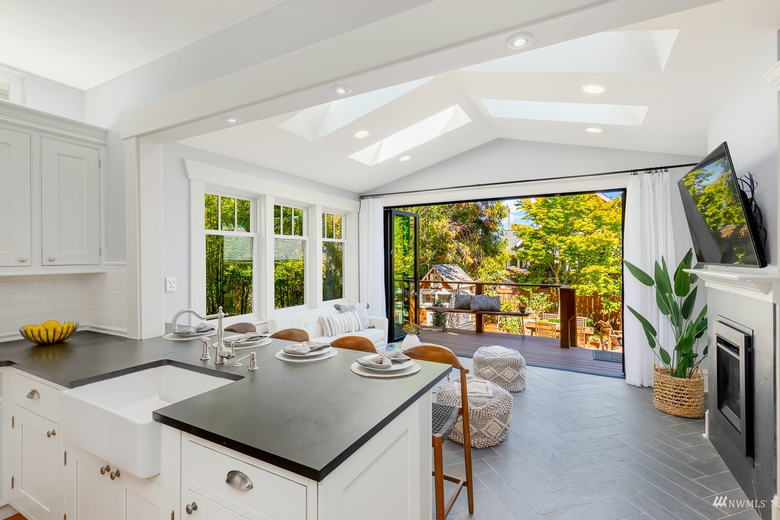 2326 North 59th Street Seattle, WA 98103 - Photo 15 of 38 a kitchen with a stove a sink and a refrigerator