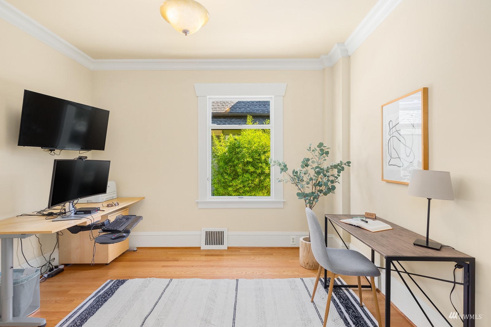 2326 North 59th Street Seattle, WA 98103 - Photo 21 of 38 a view of a workspace with furniture and a window