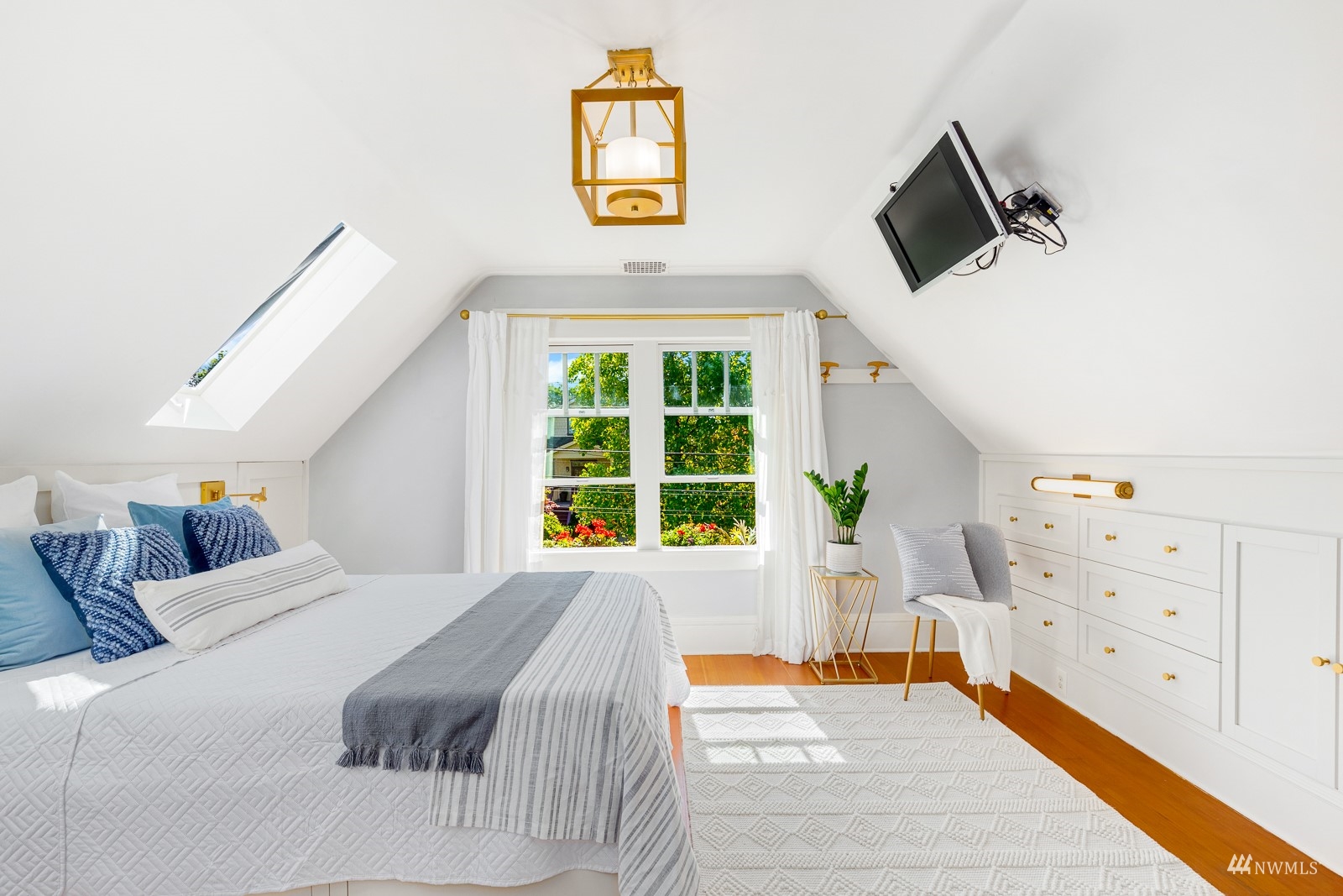 2326 North 59th Street Seattle, WA 98103 - Photo 22 of 38 a bedroom with furniture and a window