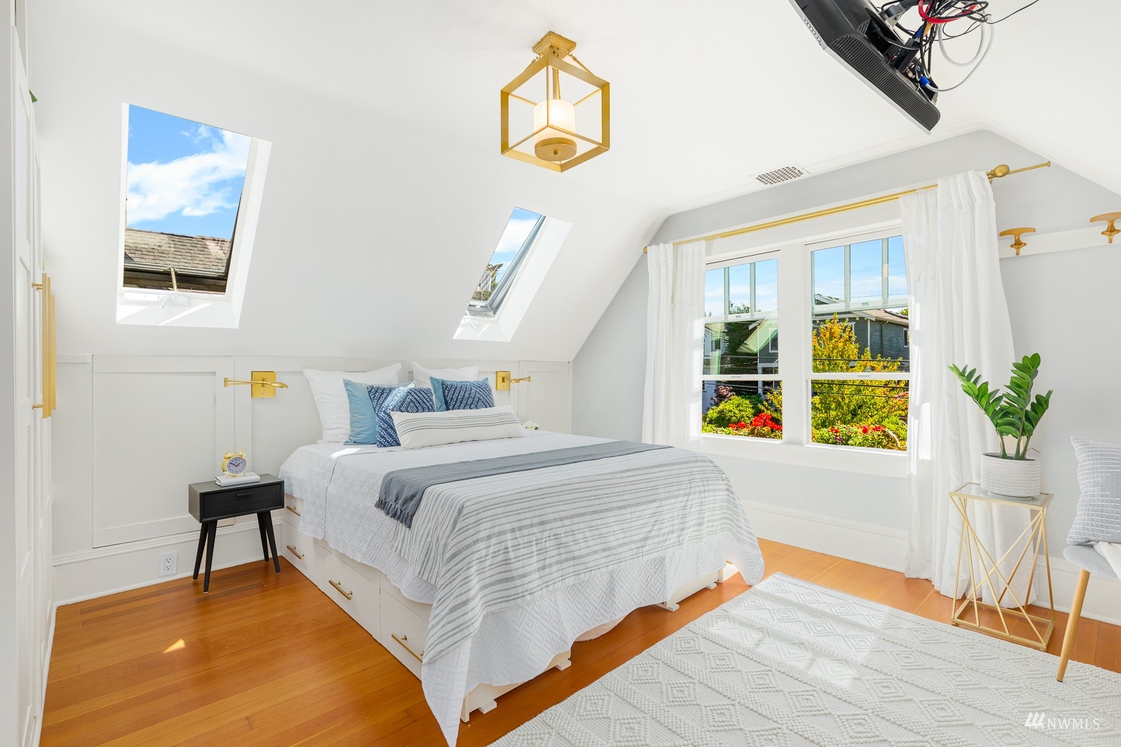2326 North 59th Street Seattle, WA 98103 - Photo 23 of 38 a bedroom with a bed and wooden floor