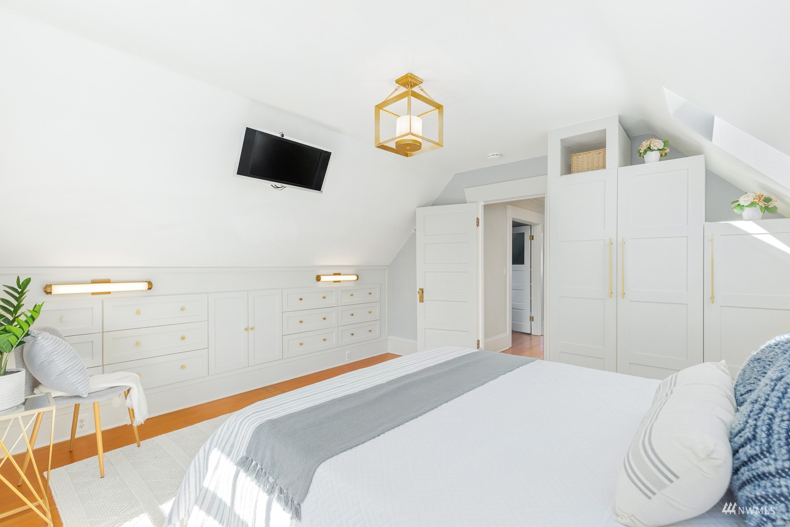 2326 North 59th Street Seattle, WA 98103 - Photo 24 of 38 a bedroom with a bed and a flat screen tv