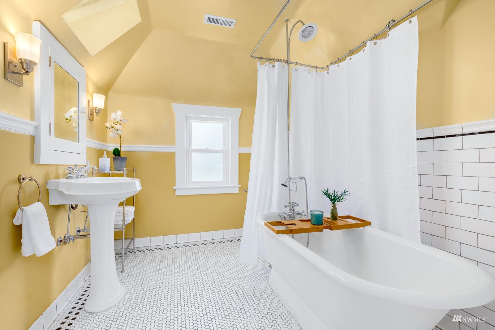 2326 North 59th Street Seattle, WA 98103 - Photo 26 of 38 a bathroom with a sink a bathtub and a shower