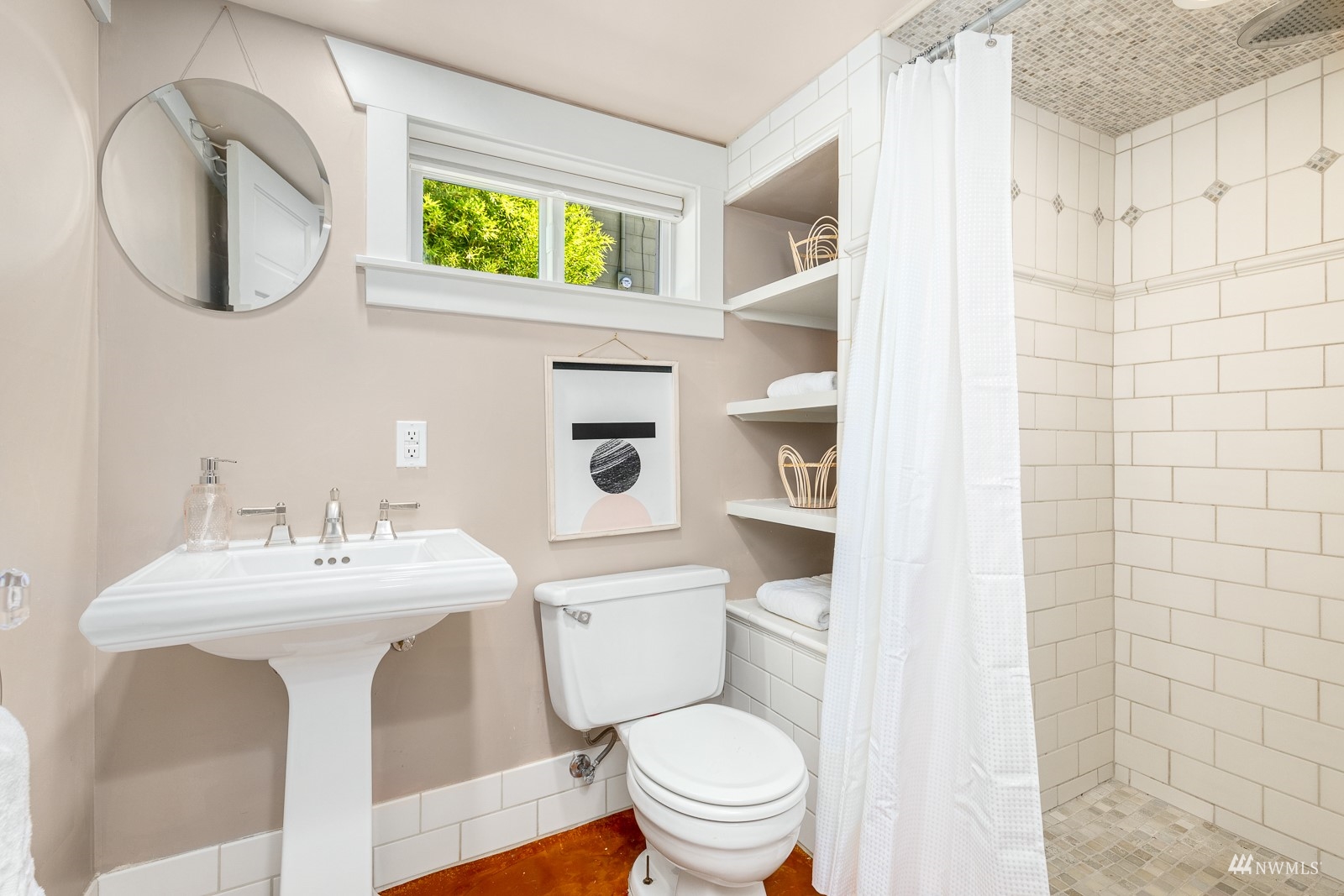 2326 North 59th Street Seattle, WA 98103 - Photo 33 of 38 a bathroom with a sink a toilet and a mirror