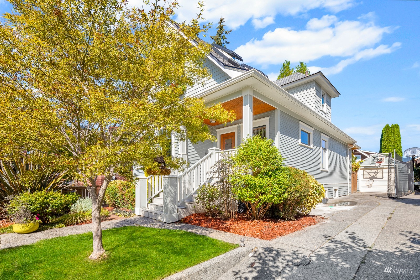 2326 North 59th Street Seattle, WA 98103 - Photo 34 of 38 front view of a house with a yard
