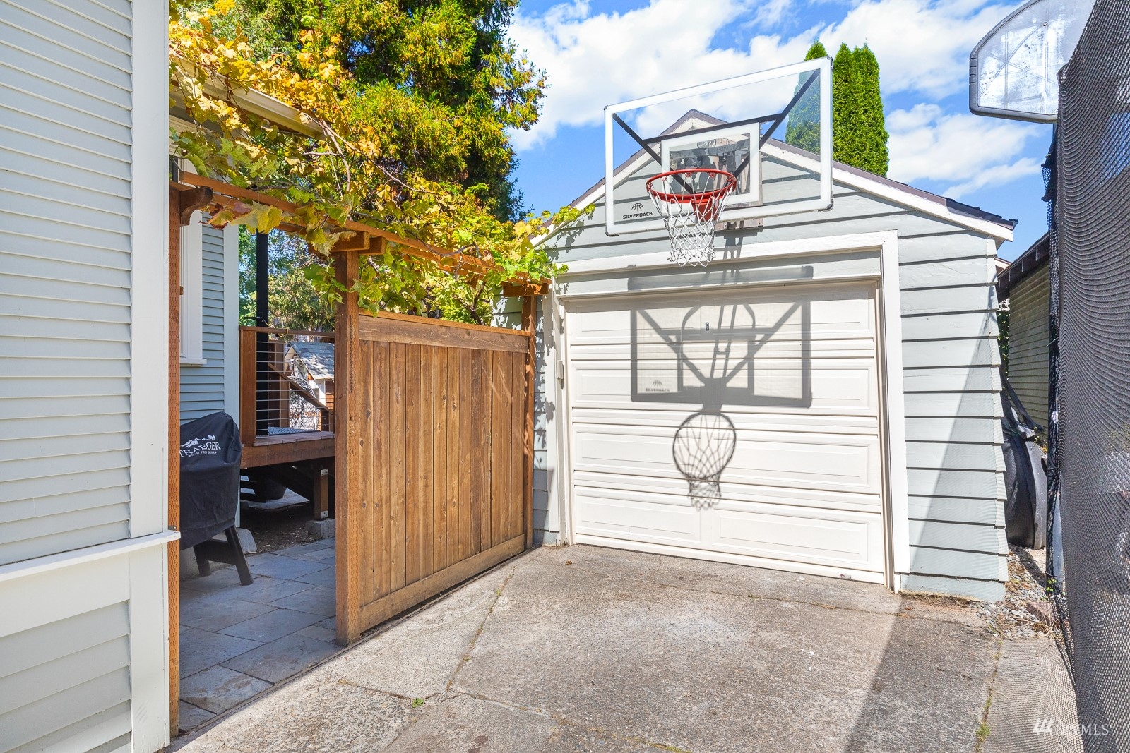 2326 North 59th Street Seattle, WA 98103 - Photo 35 of 38 a view of a room with wooden floor and fence
