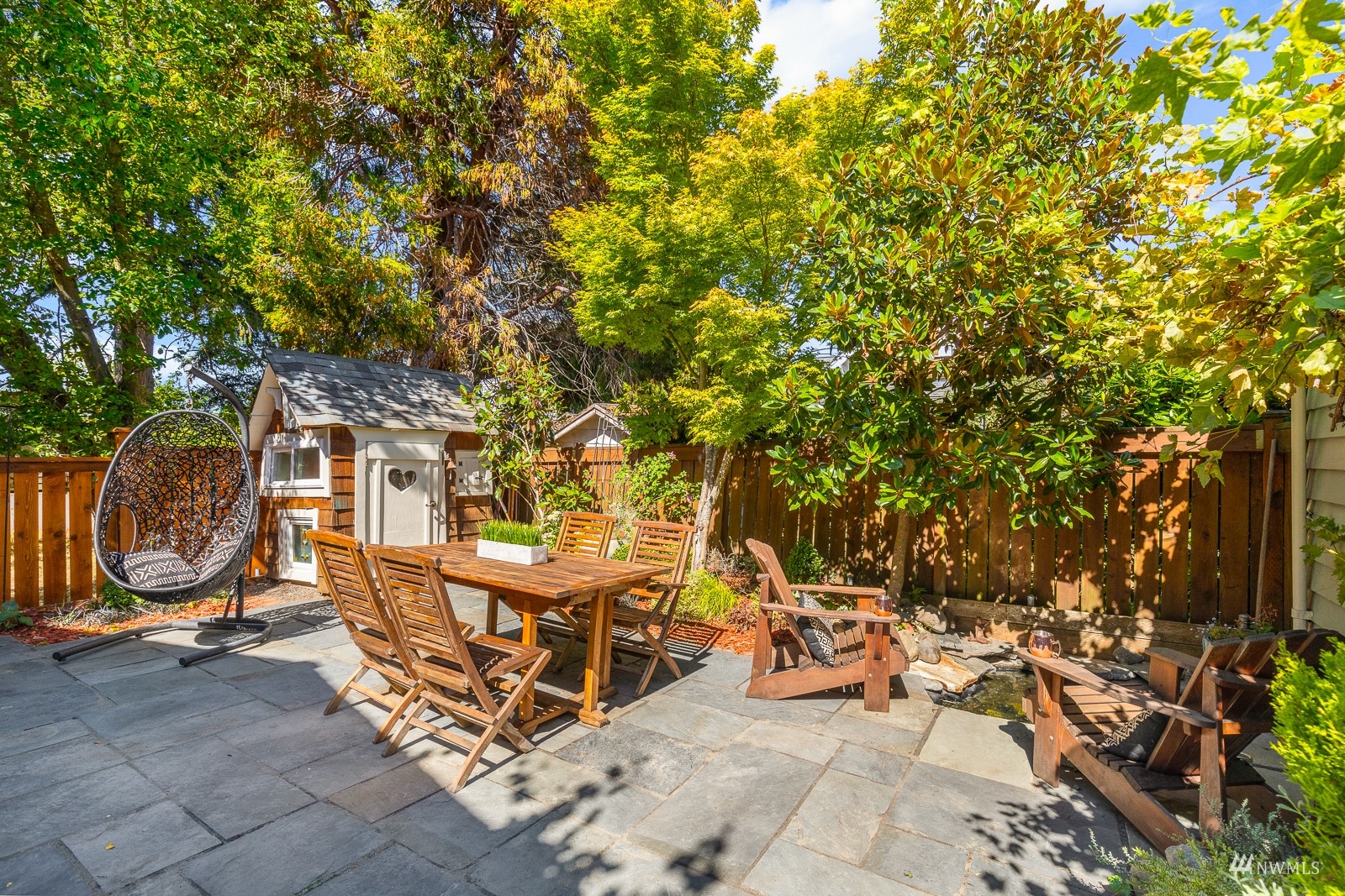 2326 North 59th Street Seattle, WA 98103 - Photo 38 of 38 a view of a chairs and table in a backyard