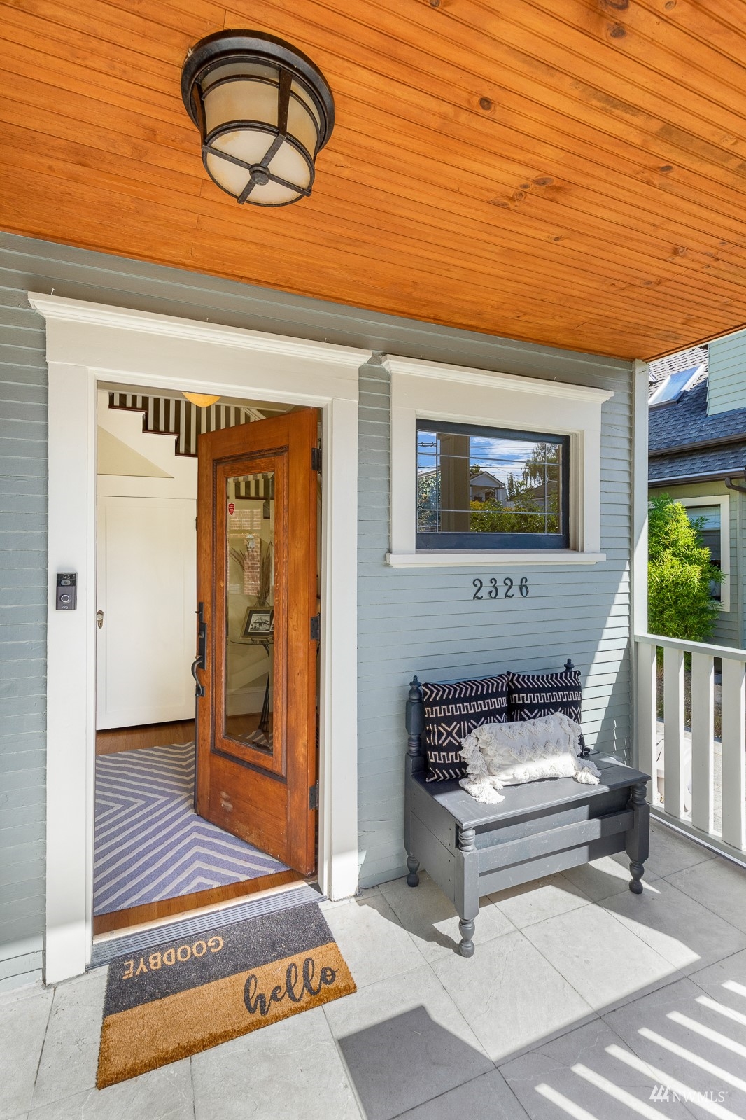 2326 North 59th Street Seattle, WA 98103 - Photo 4 of 38 a bench sitting in front of a building