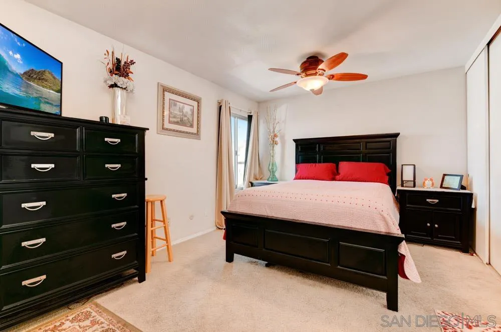 3550 Ruffin Road, Unit 261 San Diego, CA 92123 - Photo 15 of 22 a bedroom with a bed a dresser and a painting