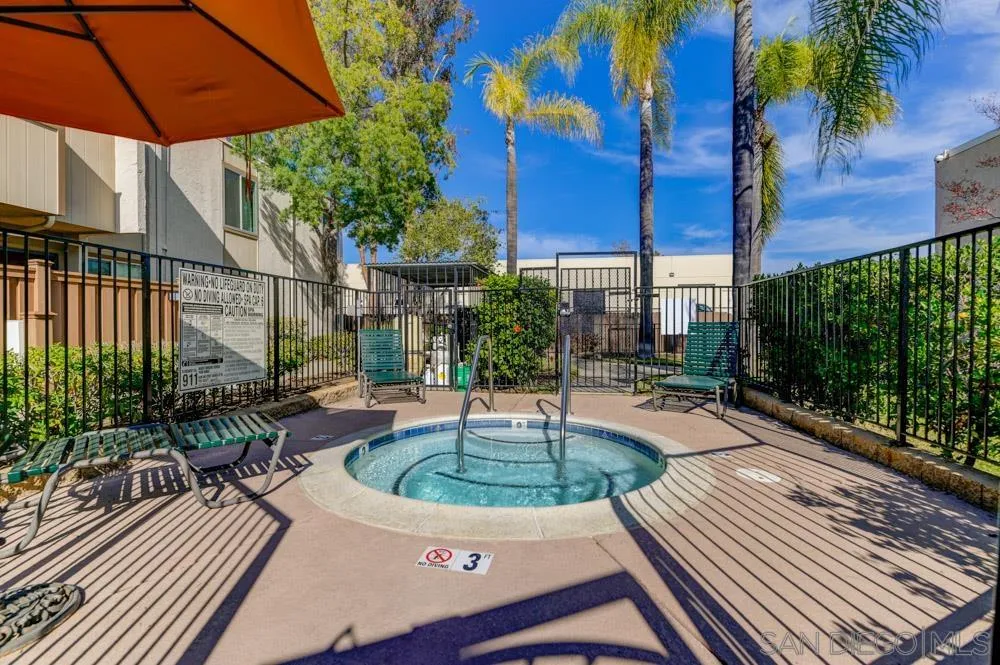 3550 Ruffin Road, Unit 261 San Diego, CA 92123 - Photo 18 of 22 a swimming pool with outdoor seating and yard