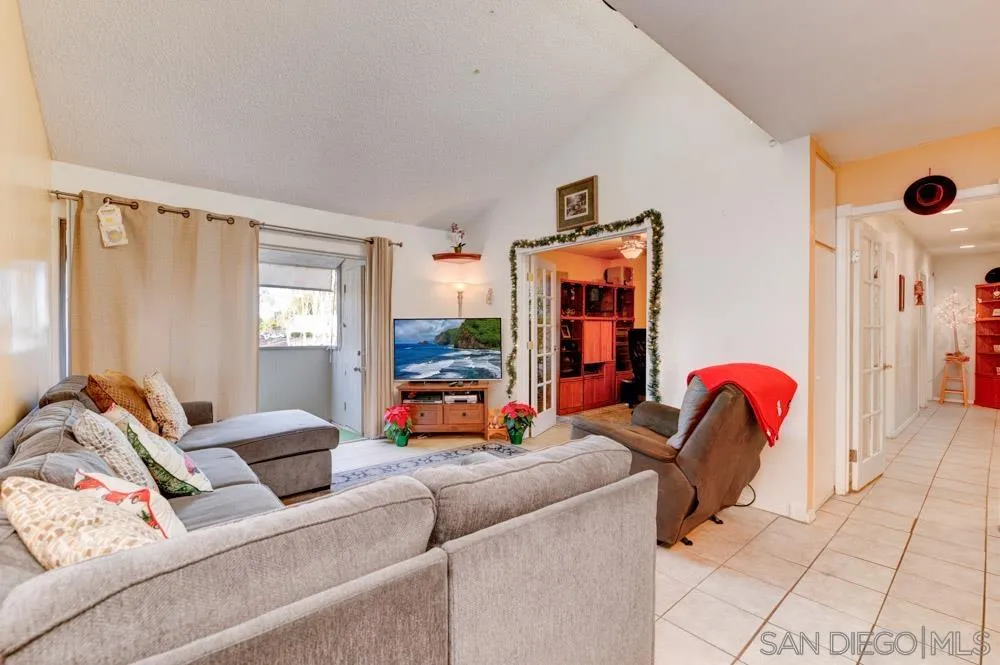3550 Ruffin Road, Unit 261 San Diego, CA 92123 - Photo 2 of 22 a bedroom with furniture and a window
