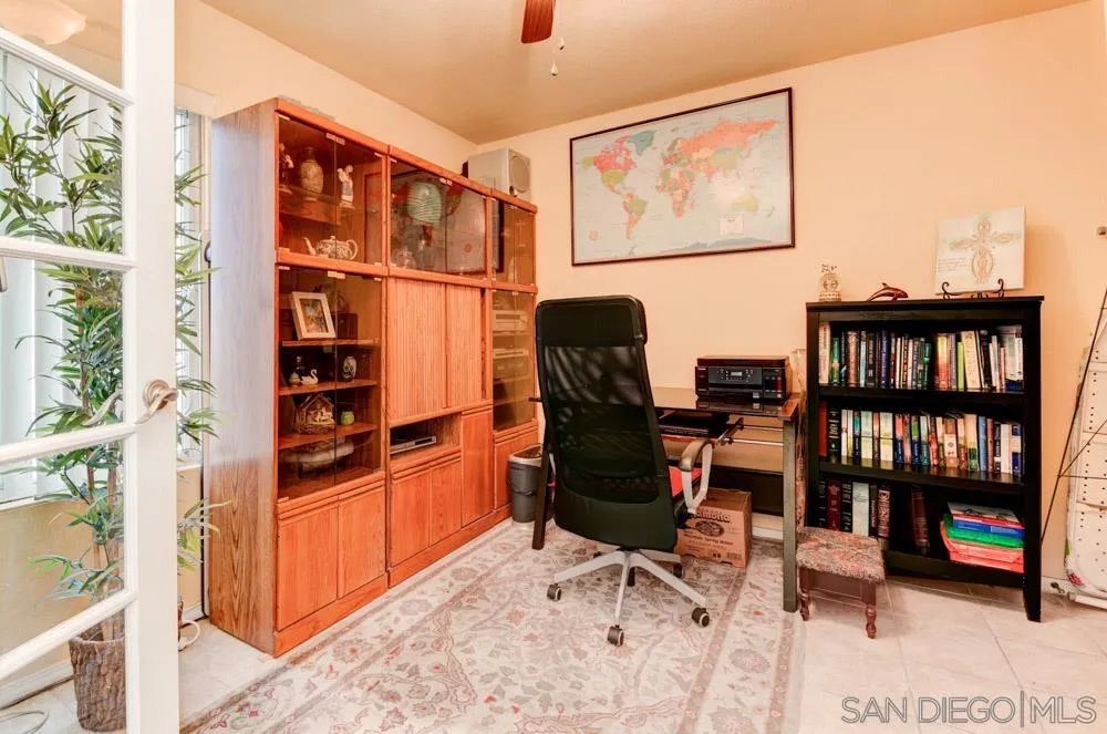 3550 Ruffin Road, Unit 261 San Diego, CA 92123 - Photo 21 of 22 a workspace with furniture and book shelf