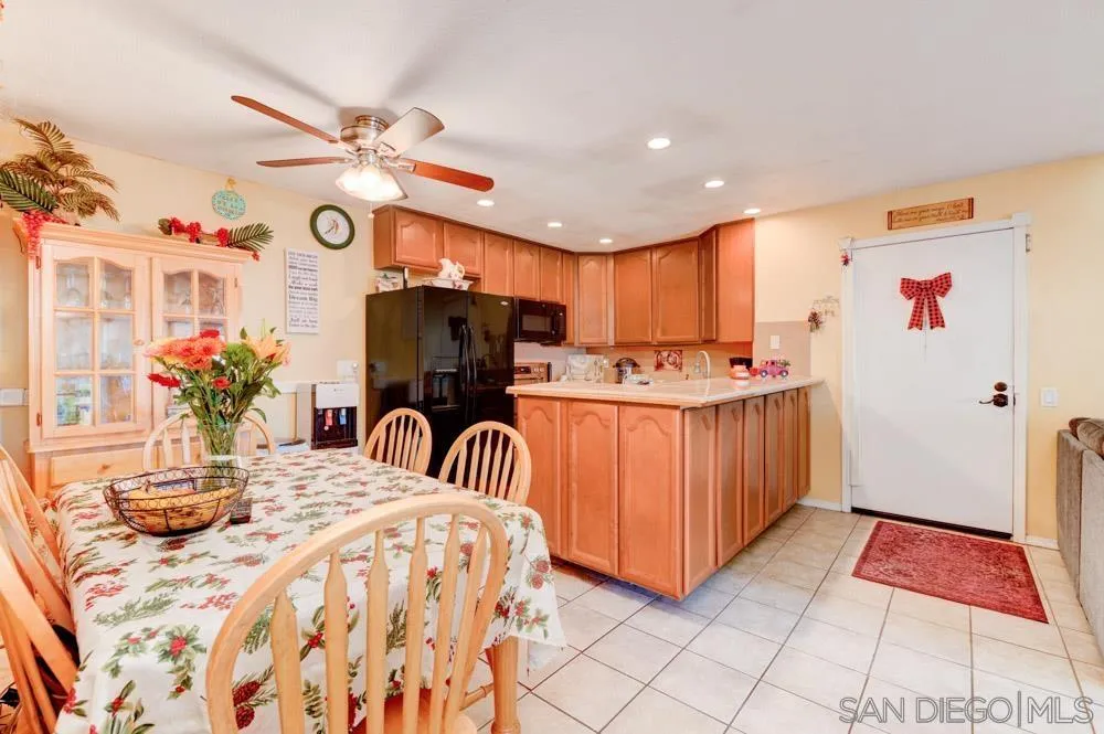 3550 Ruffin Road, Unit 261 San Diego, CA 92123 - Photo 7 of 22 a kitchen with stainless steel appliances kitchen island granite countertop a sink and cabinets
