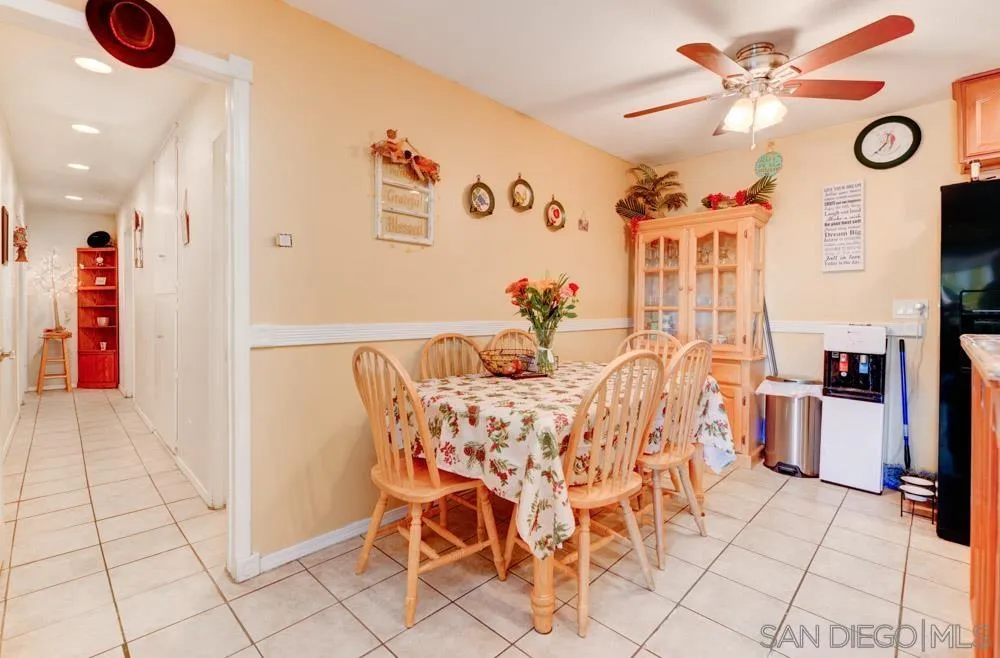 3550 Ruffin Road, Unit 261 San Diego, CA 92123 - Photo 8 of 22 a view of a dining room with furniture and a chandelier