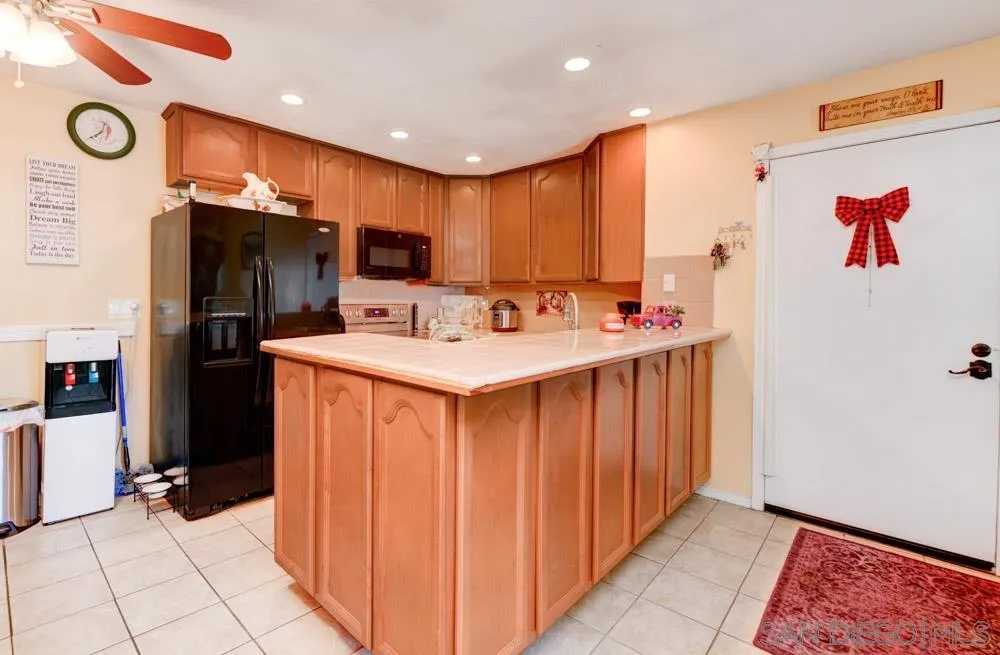 3550 Ruffin Road, Unit 261 San Diego, CA 92123 - Photo 9 of 22 a kitchen with stainless steel appliances a refrigerator and a stove