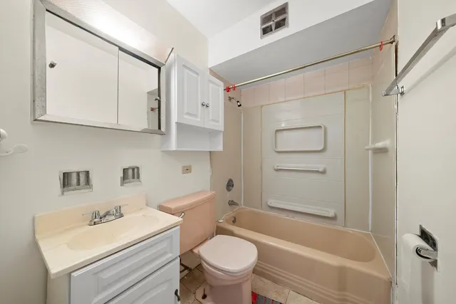 a bathroom with a sink a toilet and a bathtub