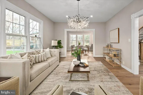 a large kitchen with stainless steel appliances granite countertop a sink and cabinets