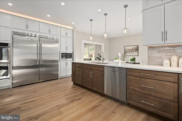 a living room with furniture a fireplace and a table