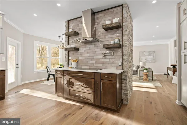 a spacious bedroom with a bed and ceiling fan
