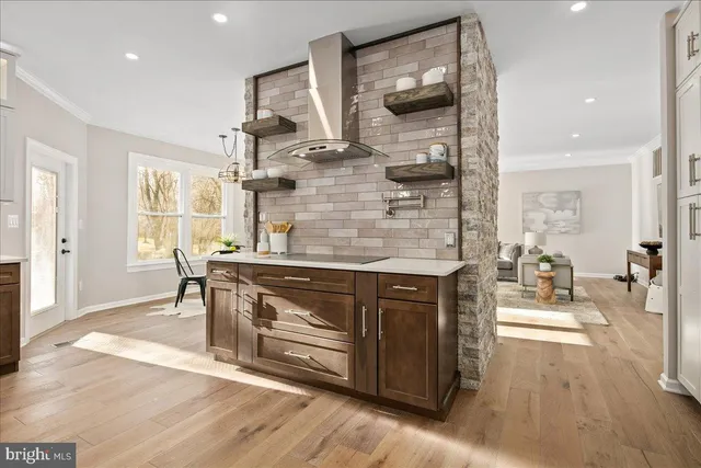 a spacious bedroom with a bed and ceiling fan