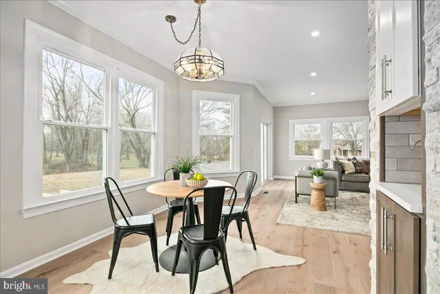 a bathroom with a double vanity sink mirror and bathtub