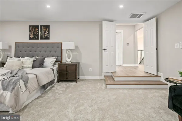 a living room with furniture or couch and a wooden floor