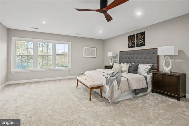 a room with a large bed and a window