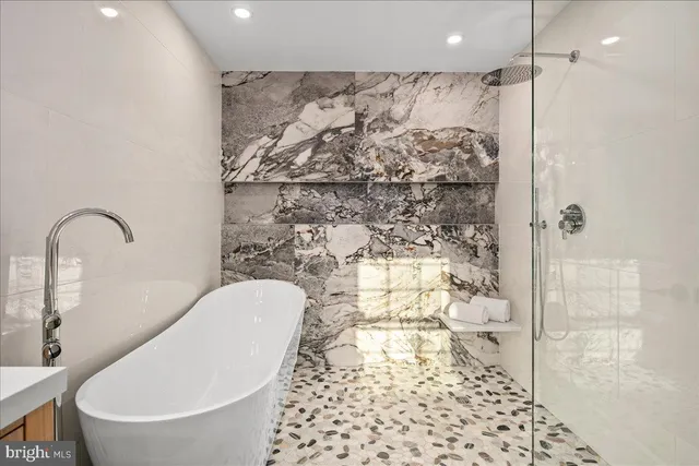 a view of a house with a big yard and large trees